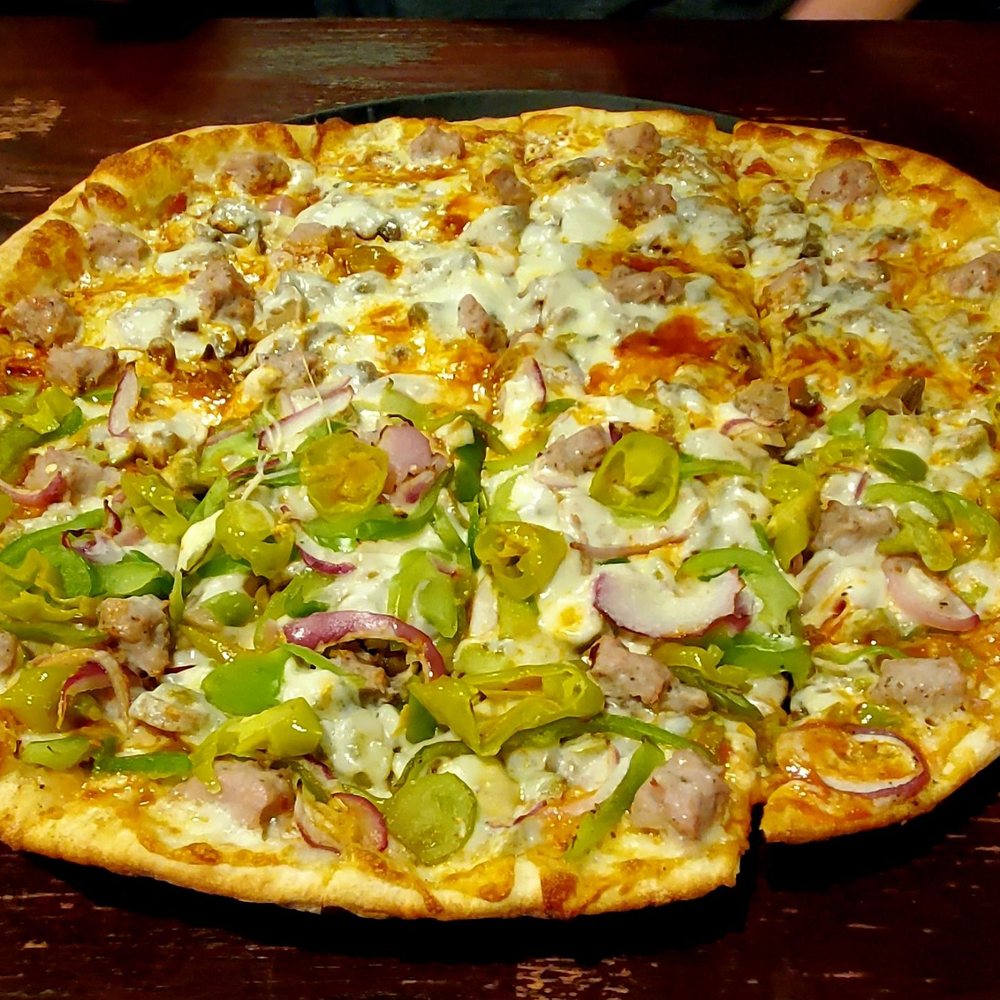 a whole pizza with various toppings a whole pizza with various toppings