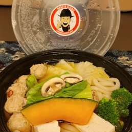 a bowl of noodles and vegetables