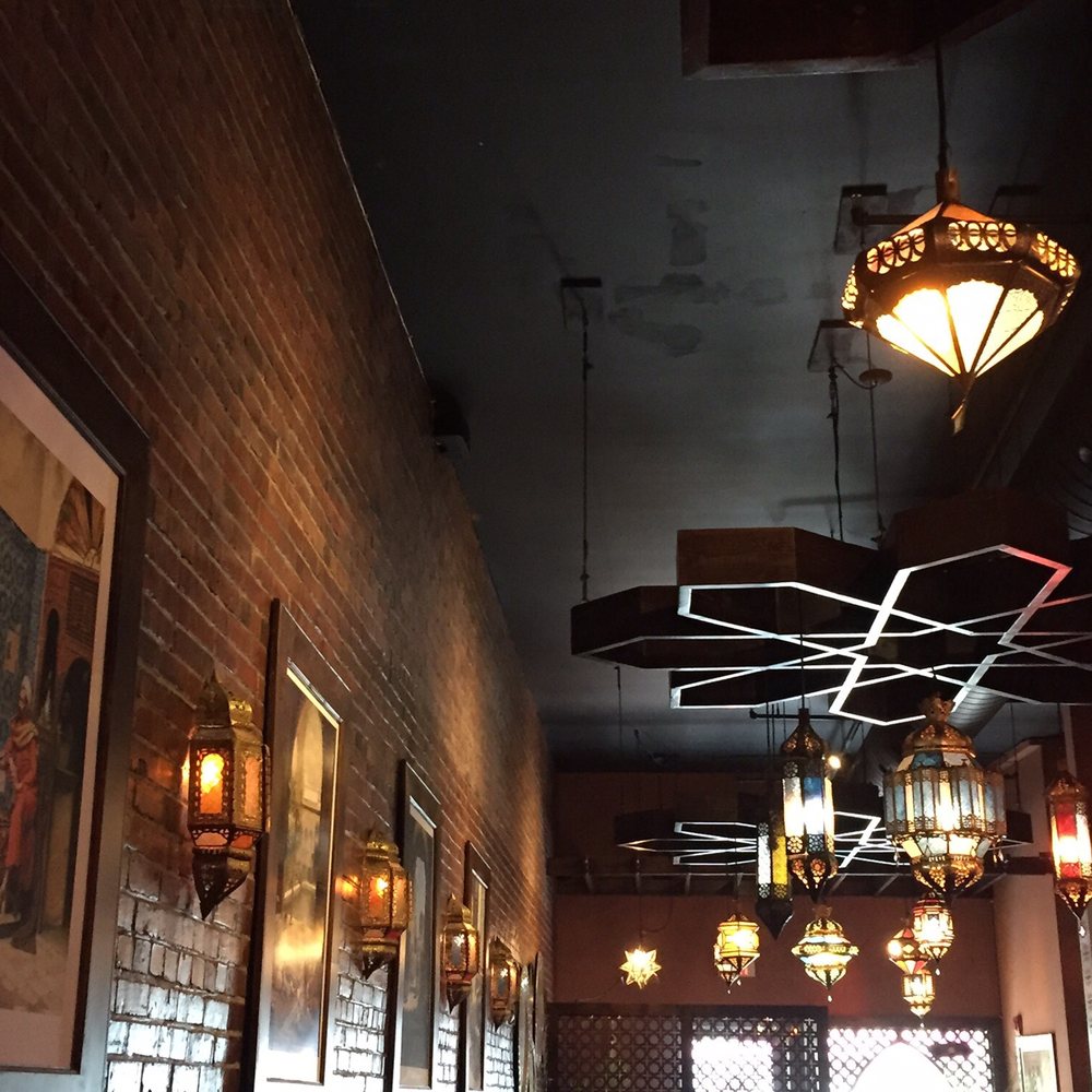 Blue Olive - a brick wall and a row of lamps - Mediterranean Near Me - Dieppe, New Brunswick