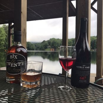 Bird Mountain Wine & Spirits - a glass of wine and a bottle of wine - Beer, Wine & Spirits Near Me - Landrum, South Carolina Bird Mountain Wine & Spirits - a glass of wine and a bottle of wine - Beer, Wine & Spirits Near Me - Landrum, South Carolina