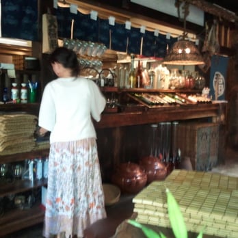 Domo - Alcohol stores act as a divider. You can hear the chefs yell their greeting from behind! - Japanese Near Me - Denver, Colorado Domo - Alcohol stores act as a divider. You can hear the chefs yell their greeting from behind! - Japanese Near Me - Denver, Colorado