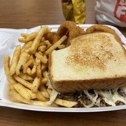 Anna's Kitchen - Cheesesteak sand-which with half fries half onion rings.
