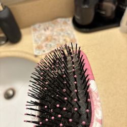 The amount of hair that came out after brushing it once