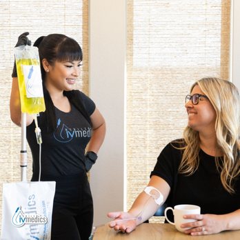 Mobile IV Medics - Nashville - Nurse assisting patient with IV hydration - IV Hydration Near Me Mobile IV Medics - Nashville - Nurse assisting patient with IV hydration - IV Hydration Near Me