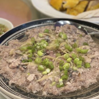 Lucky Dragon 龍圖飯店 - a plate of food on a table - Cantonese Near Me - Houston, Texas