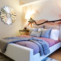 Adele Place - Spacious bedrooms with large windows and wood-style flooring.