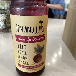 a jar of beet, apple, and lemon juice a jar of beet, apple, and lemon juice