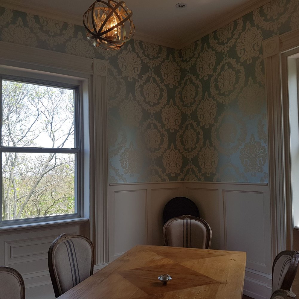 Kew Vineyards - a dining room with a table and chairs - Wineries Near Me - Lincoln, Ontario