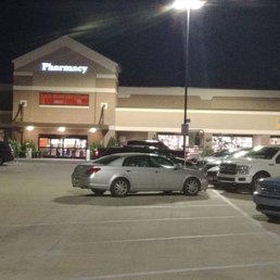 cars parked in a parking lot at night cars parked in a parking lot at night