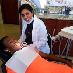 New Awareness Dentistry - Dr. Afsoon working on a patient