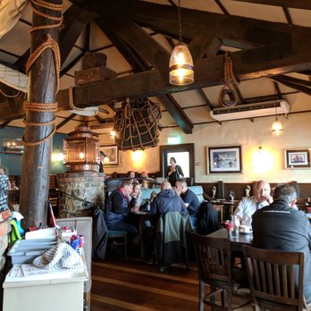 Dinos - The interior is quiet and we got a window table with views of the bay. - Seafood Near Me - Kinsale, Colorado Dinos - The interior is quiet and we got a window table with views of the bay. - Seafood Near Me - Kinsale, Colorado