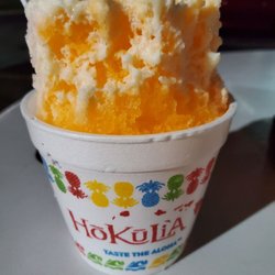 Hokulia Shave Ice - Passion fruit and lychee shave ice w/ snow cap in a long board takeout cup