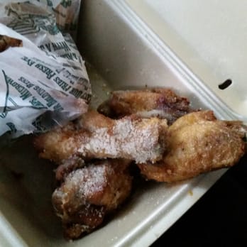 Wingstop - The two garlic parmesan wings the other two had no flavor other than grease... after this photo I tossed it all in the trash - Chicken Wings Near Me - Fresno, California