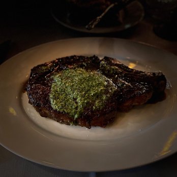 Maple & Ash - 22 oz. 28 Day Dry-Aged Bone-In Ribeye - Steakhouses Near Me - Chicago, Illinois Maple & Ash - 22 oz. 28 Day Dry-Aged Bone-In Ribeye - Steakhouses Near Me - Chicago, Illinois