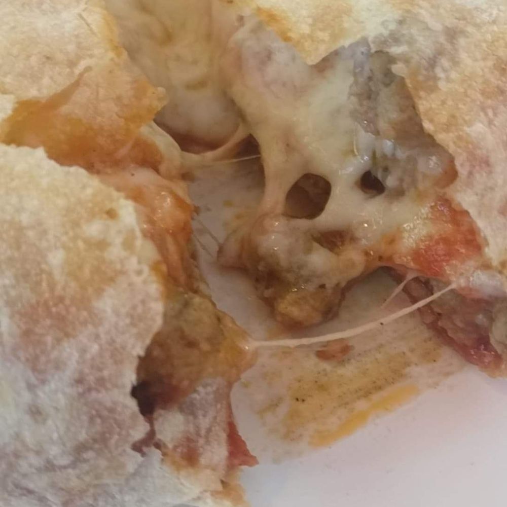One Guy from Italy University - House Calzone. Lot's of cheese, marinara, sausage, and pepperoni. Super hot when it comes out! - Pizza Near Me - Lubbock, Texas