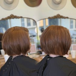 Adding in hair extensions to create a sharper edge for her bob.