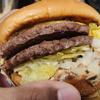 In-N-Out Burger - This burger was supposed to have mustard and ketchup instead of the spread. It's also missing chiles and tomatoes. - Fast Food Near Me - San Diego, California