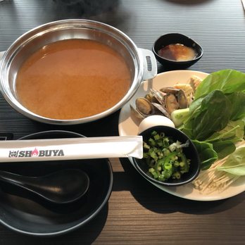 Shabuya - Spicy Miso Broth, plate from salad bar and sauce (top right) - Hot Pot Near Me - Honolulu, Hawaii Shabuya - Spicy Miso Broth, plate from salad bar and sauce (top right) - Hot Pot Near Me - Honolulu, Hawaii