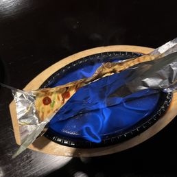 a slice of pizza on a plate