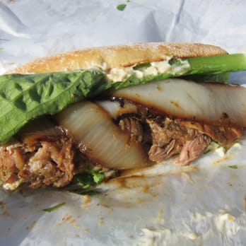 Paseo - Caribbean Roast - Pork Shoulder coated in marinade on toasted baguette with aioli - Caribbean Near Me - Seattle, Washington