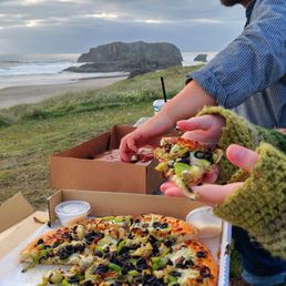 This photo features our beautiful vegetarian pizza with pesto sauce and parmesan cups. This photo features our beautiful vegetarian pizza with pesto sauce and parmesan cups.