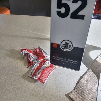 McDonald's - a bag of chips and a sign on a table - Fast Food Near Me - Las Vegas, Nevada McDonald's - a bag of chips and a sign on a table - Fast Food Near Me - Las Vegas, Nevada