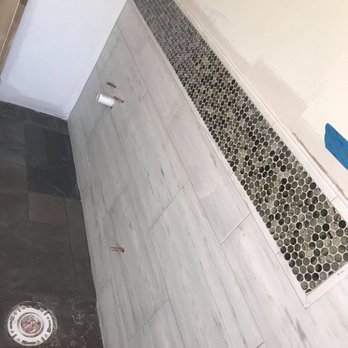 B2 Tile Design & Installation - a shower with a drain - Flooring Near Me B2 Tile Design & Installation - a shower with a drain - Flooring Near Me