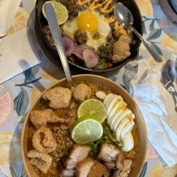 Kamayan Atl - Sizzling sisig (slow roasted pork belly, cheek, snout with pâte); Pancit palabok (rice noodles with shrimp broth sauce, tofu, minced pork) - Filipino Near Me - Doraville, Georgia Kamayan Atl - Sizzling sisig (slow roasted pork belly, cheek, snout with pâte); Pancit palabok (rice noodles with shrimp broth sauce, tofu, minced pork) - Filipino Near Me - Doraville, Georgia