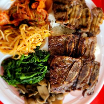 Woo's Kitchen Korean Grill Express - Gal Bi (grilled short ribs) with watercress, mushrooms, Kimchi, and Korean bean sprouts on white rice. - Korean Near Me - California, Maryland Woo's Kitchen Korean Grill Express - Gal Bi (grilled short ribs) with watercress, mushrooms, Kimchi, and Korean bean sprouts on white rice. - Korean Near Me - California, Maryland