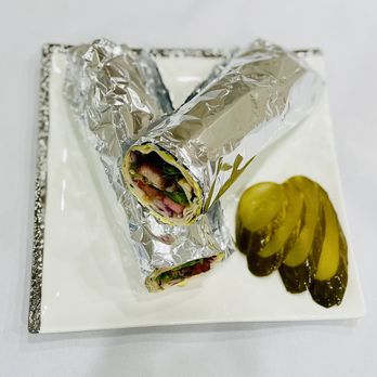 Villa Restaurant - a wrap and pickle on a plate - Mediterranean Near Me - Tujunga, California Villa Restaurant - a wrap and pickle on a plate - Mediterranean Near Me - Tujunga, California