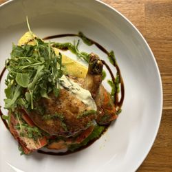 Chicken Supreme stuffed with goat cheese, roasted garlic & spinach, served with Parmesan polenta and seasonal vegetables at Rene's Bistro.