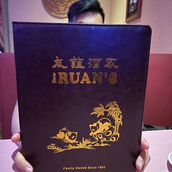 New Ruan's Restaurant and Cater - a man holding a menu - Chinese Near Me - Brooklyn, New York New Ruan's Restaurant and Cater - a man holding a menu - Chinese Near Me - Brooklyn, New York