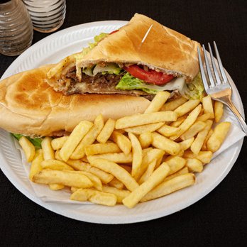 Cafe Havana - a plate of french fries and a sandwich - Cuban Near Me - Ocala, Florida