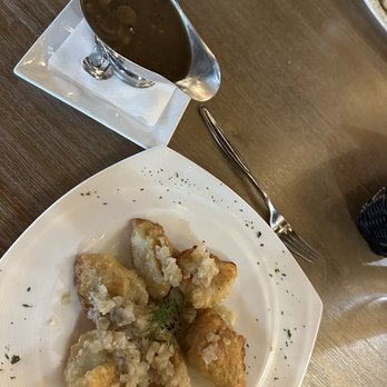 Cracovia Polish Restaurant - Fried pierogi with sauerkraut and mushroom and mushroom gravy. - Polish Near Me - Spring Hill, Florida
