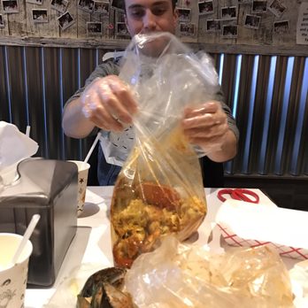The Boil Bar - Bag of Dungeness crab in Signature Sauce - Seafood Near Me - Toronto, Ontario The Boil Bar - Bag of Dungeness crab in Signature Sauce - Seafood Near Me - Toronto, Ontario