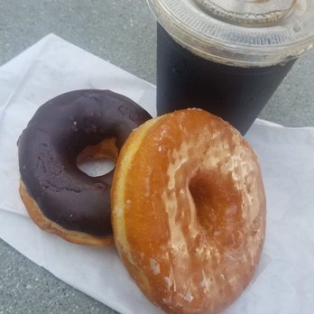 Randy's Donuts - Chocolate Raised Donut and Cold Brew Coffee! Yum! - Donuts Near Me - El Segundo, California Randy's Donuts - Chocolate Raised Donut and Cold Brew Coffee! Yum! - Donuts Near Me - El Segundo, California