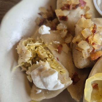 Three Brothers Restaurant - Sour cream on a pierogi. 12/13/2025 - Polish Near Me - Plymouth, Michigan Three Brothers Restaurant - Sour cream on a pierogi. 12/13/2025 - Polish Near Me - Plymouth, Michigan
