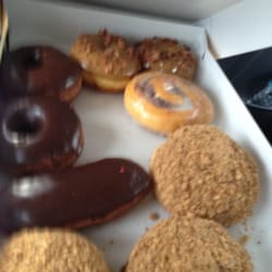 Manderfield's Home Bakery - An assortment of maple bacon, round chocolate, long john, cinnamon roll and Persians.
