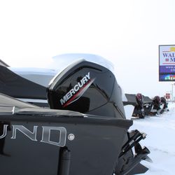 Walstrom Marine - Lund Boat by the Road Sign