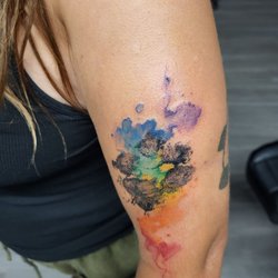 Avatar Tat2 - Her dogs paw print with watercolor rainbow bridge