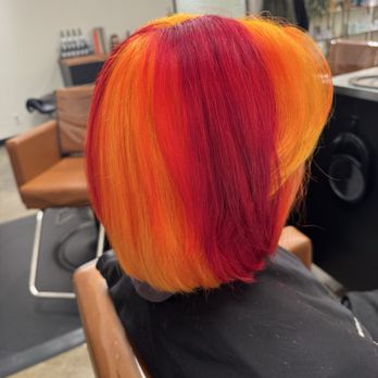 The Colour Bar Salon - Right side of hair dyed red and yellow. - Hair Salons Near Me - Sacramento, California The Colour Bar Salon - Right side of hair dyed red and yellow. - Hair Salons Near Me - Sacramento, California
