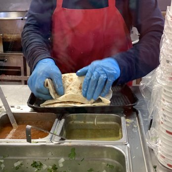 La Reyna Market - Rolling the burrito. - Mexican Near Me - Paso Robles, California La Reyna Market - Rolling the burrito. - Mexican Near Me - Paso Robles, California