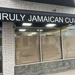 Unruly Jamaican Cuisine - Closed, boarded up windows