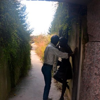 Grounds For Sculpture - Statues stealing a kiss under an overpass. - Museums Near Me - Hamilton, New Jersey