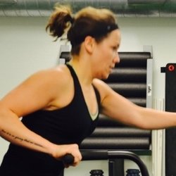 Ethos Fitness + Performance - Becky pushing hard during her Team MetCon fan bike sprints