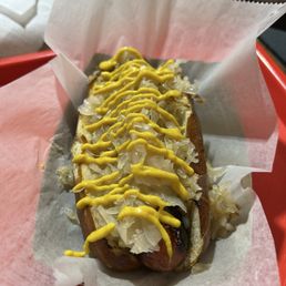 All beef hotdog with sauerkraut and mustard