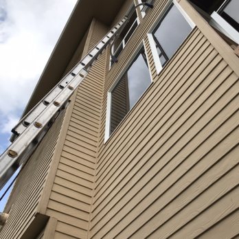 Mountain View Window Cleaning - Setting up a ladder for traditional window cleaning. - Window Washing Near Me Mountain View Window Cleaning - Setting up a ladder for traditional window cleaning. - Window Washing Near Me