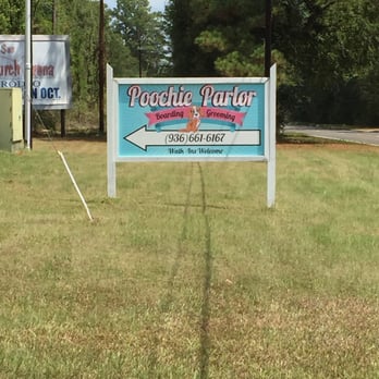 Poochie Parlor - Sign by road. - Pet Sitting Near Me - Trinity, Texas