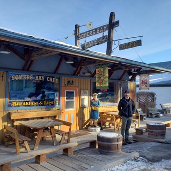 Somers Bay Cafe - a man standing outside - American Near Me - Somers, Montana Somers Bay Cafe - a man standing outside - American Near Me - Somers, Montana