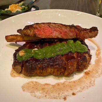 Peak with Priceless Restaurant & Bar - Steak w bone marrow and chimmichuri - New American Near Me - New York, New York Peak with Priceless Restaurant & Bar - Steak w bone marrow and chimmichuri - New American Near Me - New York, New York